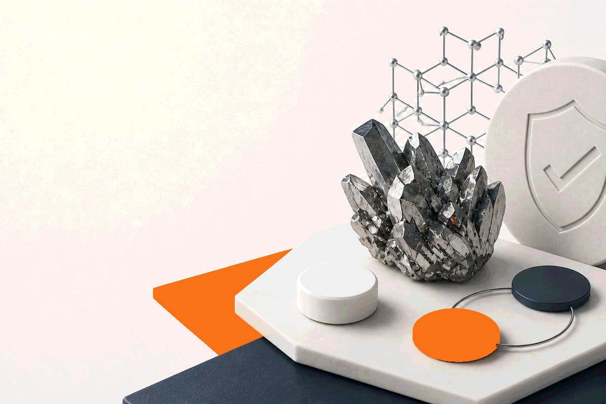 A zinc mineral crystal beside an unbranded tablet and simple elemental-dose markers in LongevityMate orange and deep slate